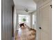 Hallway view showcasing stylish interior doors, hardwood floors, and a glimpse into a bright living room at 1509 Diamond Head Dr, Decatur, GA 30033