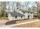 Beautiful two-story brick home featuring light blue shutters, a well-manicured yard, and an attached two-car garage at 1509 Diamond Head Dr, Decatur, GA 30033