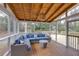 Cozy screened-in sunroom featuring comfortable seating and a wood-paneled ceiling at 1509 Diamond Head Dr, Decatur, GA 30033