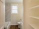 Bathroom including shelving, wood-look flooring, and a tub with shower at 3499 Villa Se Cir, Atlanta, GA 30354