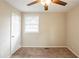 Calm bedroom with neutral carpet, ceiling fan, one window, and ample closet space at 3499 Villa Se Cir, Atlanta, GA 30354