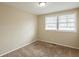Bedroom featuring neutral walls, carpet flooring, and two windows with blinds at 3499 Villa Se Cir, Atlanta, GA 30354