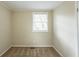 Small bedroom with neutral walls and carpet featuring a window with blinds at 3499 Villa Se Cir, Atlanta, GA 30354