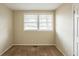 Small bedroom featuring neutral walls, carpet flooring, and a window with blinds at 3499 Villa Se Cir, Atlanta, GA 30354
