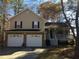 Charming two-story home features an attached two-car garage and covered porch, perfect for enjoying the outdoors at 443 Hannah Dr, Temple, GA 30179