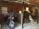 Unfinished garage with motorcycle and bicycles, perfect for a hobbyist or storage at 443 Hannah Dr, Temple, GA 30179