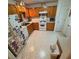 Functional kitchen design features wooden cabinets, white appliances and an adjacent door at 443 Hannah Dr, Temple, GA 30179