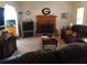 Inviting living room features a brick fireplace and ample space for relaxation and entertainment at 443 Hannah Dr, Temple, GA 30179