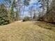 Large backyard with a gentle slope at 96 Sir Scott Ct, Lawrenceville, GA 30044