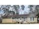 Charming single-story home with a brick and tan exterior and well-maintained front yard at 96 Sir Scott Ct, Lawrenceville, GA 30044