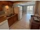 Well-lit kitchen featuring tile floors, a modern sink, and ample wooden cabinets at 96 Sir Scott Ct, Lawrenceville, GA 30044