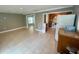 Open-concept living room flowing into kitchen with tile flooring for easy maintenance at 96 Sir Scott Ct, Lawrenceville, GA 30044