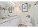 Well-lit bathroom with a granite countertop and decorative elements at 255 N Loblolly Xing, Temple, GA 30179