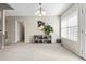 Bright dining room with large window, shoe storage, and modern chandelier at 255 N Loblolly Xing, Temple, GA 30179