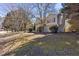 Suburban home featuring manicured landscaping and mature trees in a peaceful, verdant neighborhood at 255 N Loblolly Xing, Temple, GA 30179