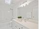 Well-lit bathroom featuring a vanity, mirror, shower, and skylight at 4550 Wenden Ln, Marietta, GA 30062