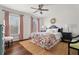 Bedroom with hardwood floors, pink accents, and abundant natural light at 4550 Wenden Ln, Marietta, GA 30062