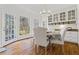 Bright dining area with large windows and elegant built-in cabinets at 4550 Wenden Ln, Marietta, GA 30062