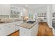 Modern kitchen featuring granite countertops and a stylish central island cooktop at 4550 Wenden Ln, Marietta, GA 30062