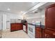 Basement kitchenette with dark cabinets, tile backsplash, and appliances at 4550 Wenden Ln, Marietta, GA 30062