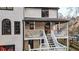 A back porch with sunburst railings and stairs leading down to the yard, showing outdoor living space at 559 Fairway Dr, Woodstock, GA 30189