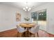 Cozy dining area with a view of the backyard with access to the wooden patio through glass sliding doors at 5935 Mountain Top Pl, Cumming, GA 30041