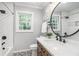 Stylish bathroom with a herringbone-tiled shower and a modern vanity at 1048 Brookdale Dr, East Point, GA 30344