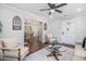 Cozy living room featuring neutral tones and a glass coffee table at 1048 Brookdale Dr, East Point, GA 30344