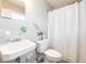 Bathroom featuring a white shower curtain, patterned floor, and white sink at 202 Porter Ln, Jonesboro, GA 30236