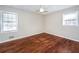 Bedroom featuring two windows, neutral paint and hardwood floors at 202 Porter Ln, Jonesboro, GA 30236