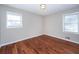 Bedroom featuring two windows, neutral paint and hardwood floors at 202 Porter Ln, Jonesboro, GA 30236