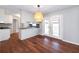 Open-concept dining room connecting to the kitchen and featuring glass doors to outside at 202 Porter Ln, Jonesboro, GA 30236