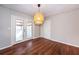 Dining room with a stylish light fixture and glass doors leading to outdoor area at 202 Porter Ln, Jonesboro, GA 30236