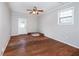 Cozy room with wood paneled walls, hardwood floors, and an exterior access door at 202 Porter Ln, Jonesboro, GA 30236