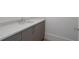 Modern bathroom vanity with gray cabinets, stone countertop and chrome fixtures at 2425 Peachtree Rd # 1806, Atlanta, GA 30305