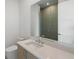 Modern bathroom with a sleek vanity and a tiled glass-enclosed shower at 2425 Peachtree Rd # 1806, Atlanta, GA 30305