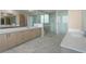 Stylish bathroom showcasing dual vanities, marble floors, and a spacious glass-enclosed shower at 2425 Peachtree Rd # 1806, Atlanta, GA 30305