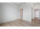 Bright bedroom features hardwood floors, white walls, and natural light at 2425 Peachtree Rd # 1806, Atlanta, GA 30305