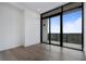 Bright bedroom with large windows and hardwood floors, perfect for relaxing and enjoying the view at 2425 Peachtree Rd # 1806, Atlanta, GA 30305