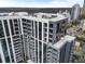 View of high-rise with balconies and roof terraces overlooking the surrounding neighborhood at 2425 Peachtree Rd # 1806, Atlanta, GA 30305