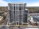 Elegant high-rise building with modern architecture, street view, and well-maintained landscaping at 2425 Peachtree Rd # 1806, Atlanta, GA 30305