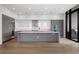 Modern kitchen with a large island and stainless steel appliances and plenty of cabinet space at 2425 Peachtree Rd # 1806, Atlanta, GA 30305
