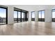 Bright living room boasts hardwood floors, large windows, and cityscape views at 2425 Peachtree Rd # 1806, Atlanta, GA 30305