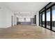 Open-concept living room and kitchen with modern appliances and floor-to-ceiling windows providing great views at 2425 Peachtree Rd # 1806, Atlanta, GA 30305
