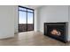Bright living room boasts a fireplace and wall-to-wall windows with beautiful views at 2425 Peachtree Rd # 1806, Atlanta, GA 30305