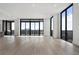 Open concept living room with floor-to-ceiling windows and city views at 2425 Peachtree Rd # 1806, Atlanta, GA 30305