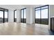 Bright living room features floor-to-ceiling windows and beautiful outdoor scenery at 2425 Peachtree Rd # 1806, Atlanta, GA 30305