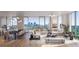 Bright living room with dining area features floor-to-ceiling windows and city views at 2425 Peachtree Rd # 1806, Atlanta, GA 30305