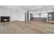Bright, open-concept living room with fireplace flows into modern kitchen with stainless steel appliances at 2425 Peachtree Rd # 1806, Atlanta, GA 30305