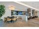 Resident lounge featuring a long bar with multiple TVs and a table at 2425 Peachtree Rd # 1806, Atlanta, GA 30305